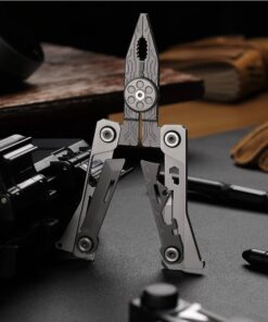 A multi tool knife balanced sitting with pliers opened on a black table.