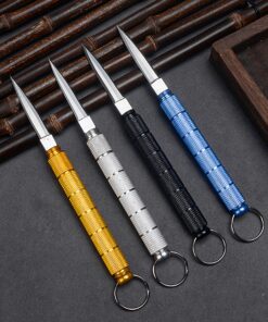 Four small pen knives resting against bamboo matting.